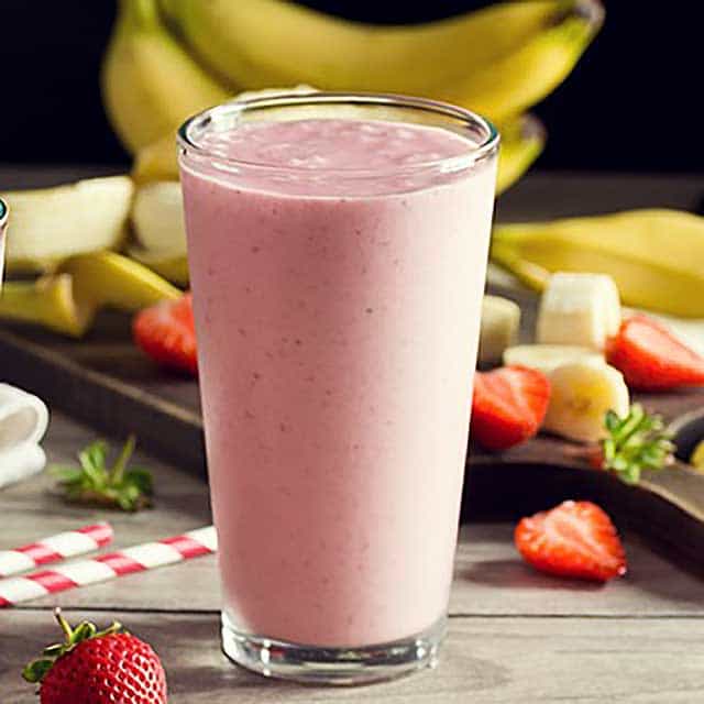 Healthy fruit smoothie with strawberries, bananas, and cacao-nut