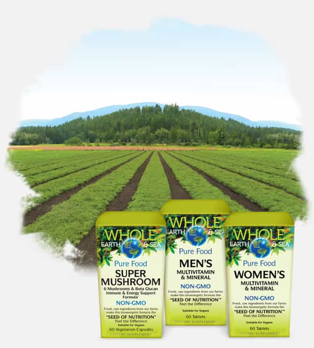 Whole Earth & Sea Pure Food Vitamins against a green field Whole Earth & Sea Pure Food Vitamins against a green field