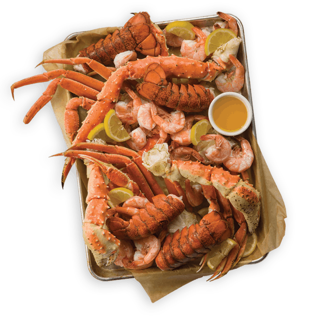 Lobster tails, king crab legs and shrimp on a platter Lobster tails and king crab legs on a platter