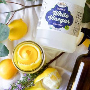 Bottle of Sprouts Organic White Vinegar shown with lemons