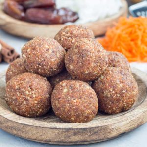carrot cake balls on a wooden plate