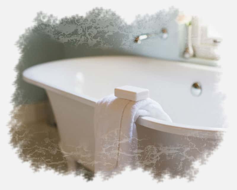 Relaxing bathtub with towel and bar soap Relaxing bathtub with towel and bar soap