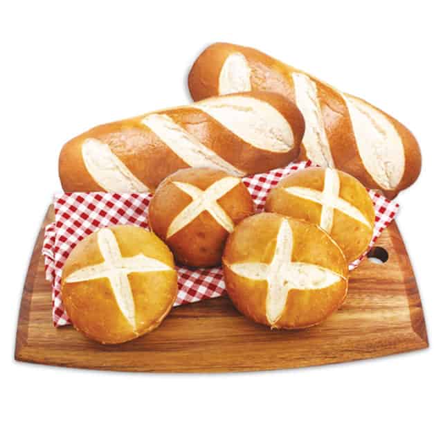 Pretzel buns and hoagies on a cutting board Pretzel buns and hoagies on a cutting board