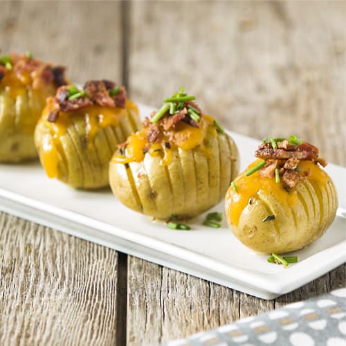 Gluten-Free Hasselback Potatoes on White Plate