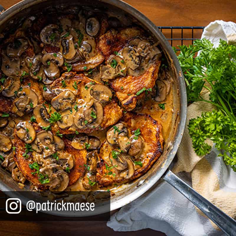 Mushroom garlic roasted pork in a pan