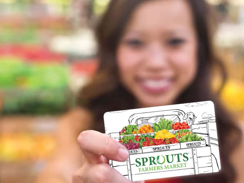 Girl smiling with Sprouts Gift Card