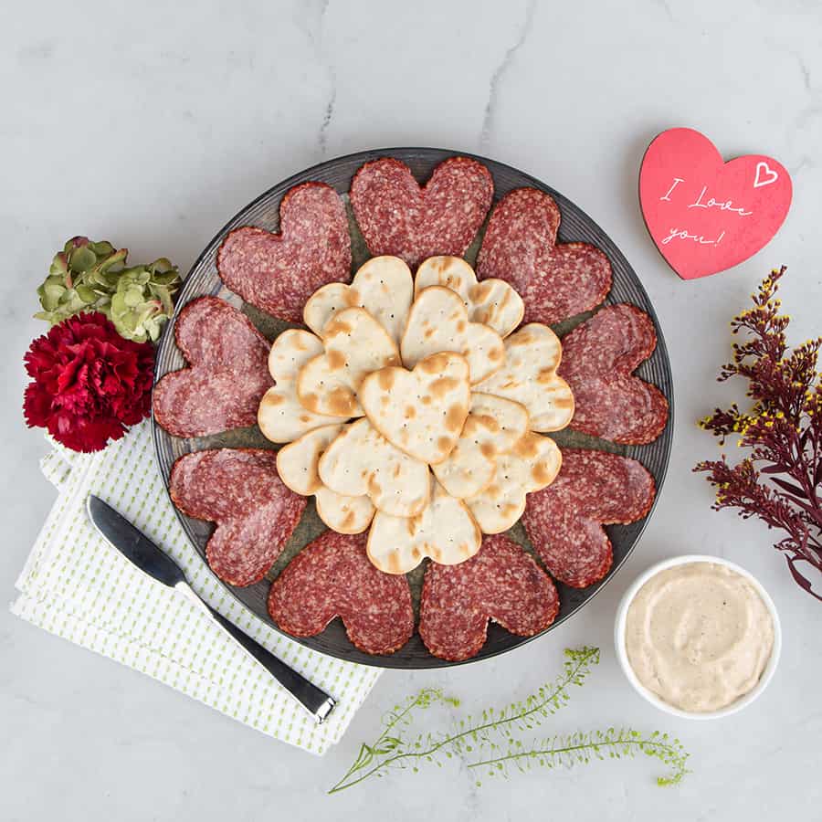 heart-shaped salami with crackers