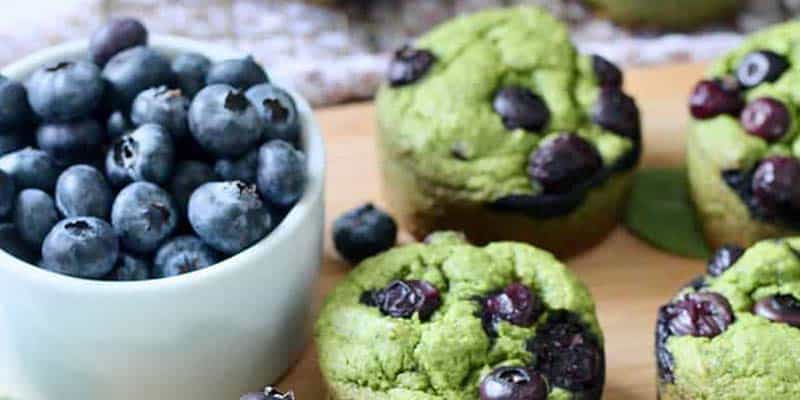 Blueberry Spinach Muffins on a table.