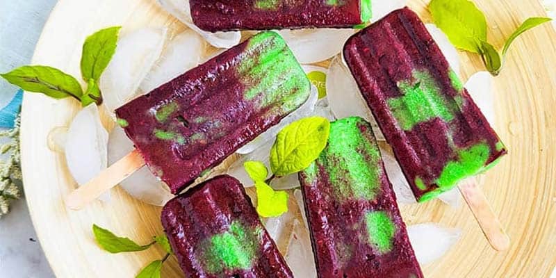 Popsicles on a a wooden plate