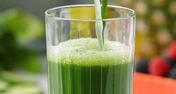 apple spinach cucumber juice in a glass