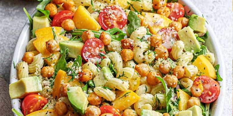 arugula peach salad in a bowl