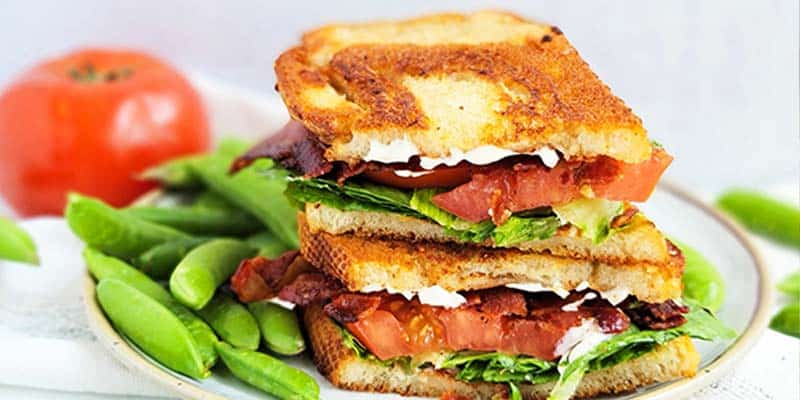 classic sourdough BLT stacked on a plate