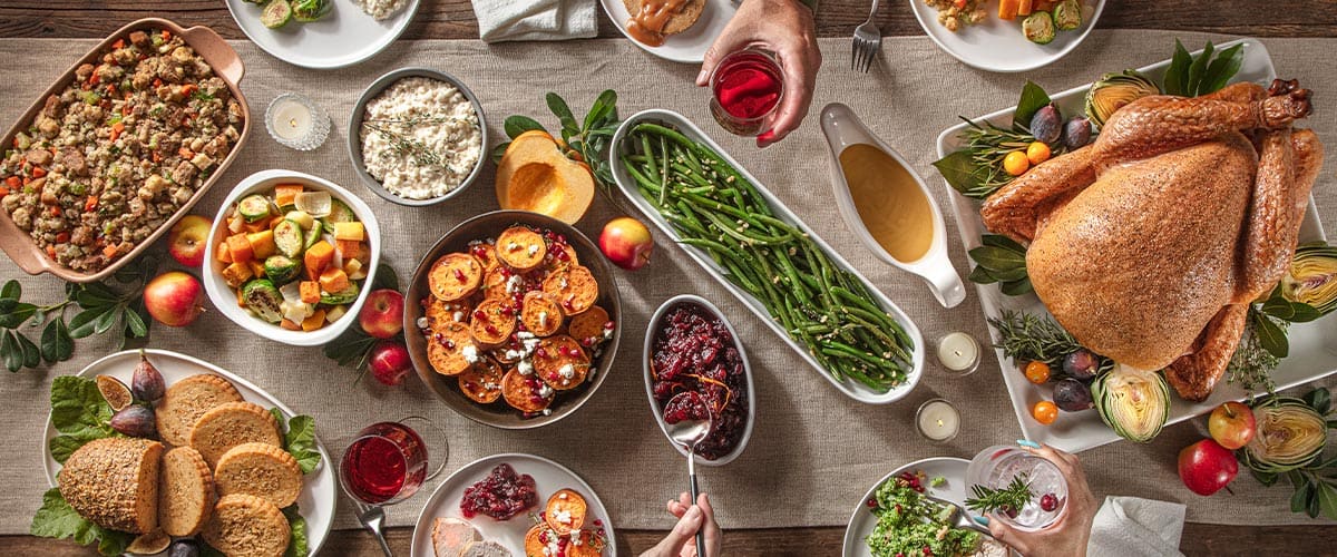 full holiday meal with centerpiece meats and sides