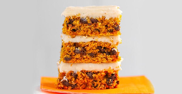pumpkin bars stacked on a plate