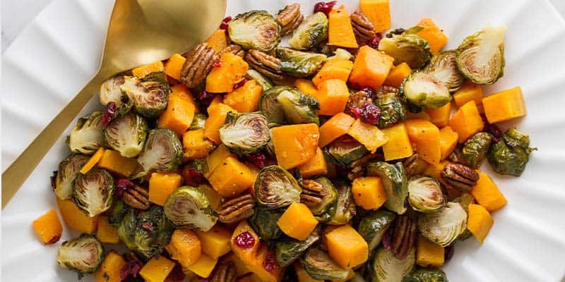 Roasted Brussel sprouts and squash in a serving dish