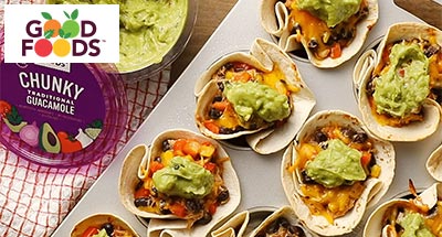 Enchilada bites next to a tub of Good Foods guacamole