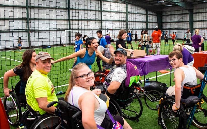 kids in in wheelchairs in a sports complex