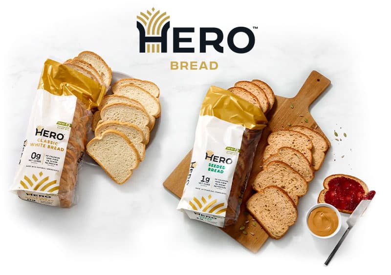 Hero Bread logo above bread varieties on a tabletop