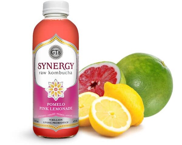 GT's synergy Pomelo Pink Lemonade flavor next to fruit