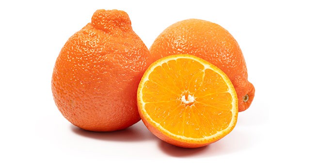 whole and sliced minneola tangelos