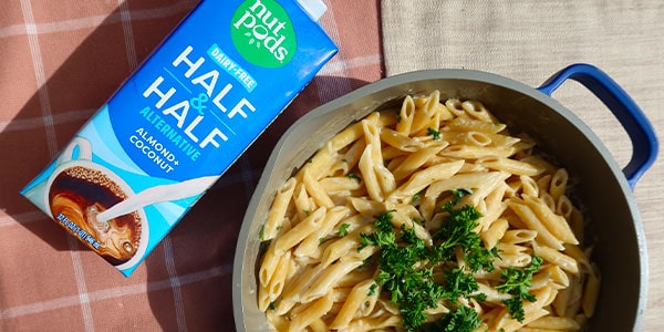 creamy garlic pasta next to nut pods half & half box.