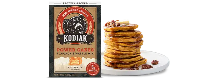 Kodiak Cakes buttermilk mix next to a stack of pancakes