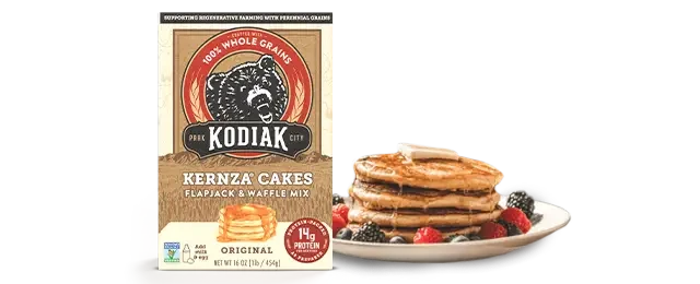 Kodiak Kernza Pancake and waffle mix next to a stack of pancakes