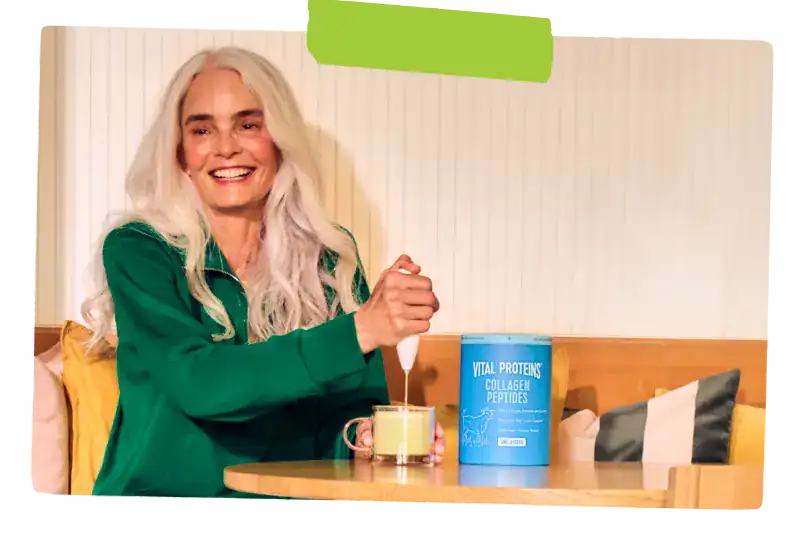 Woman stirring vital proteins into her drink.