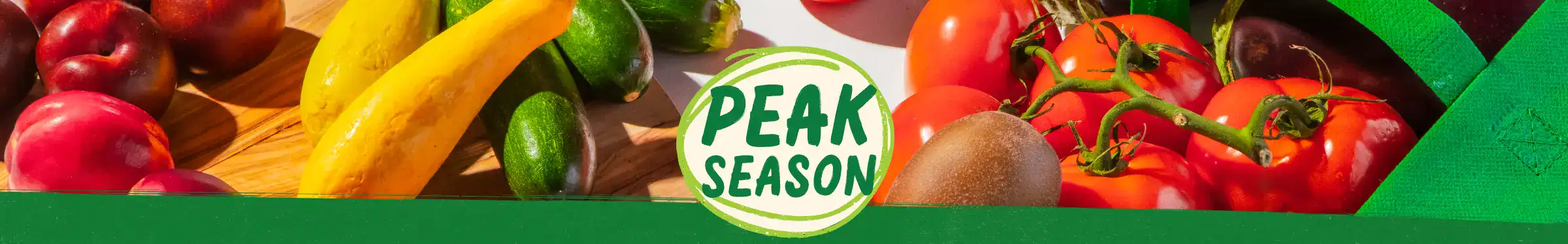 Peak Season Produce logo surrounded by produce